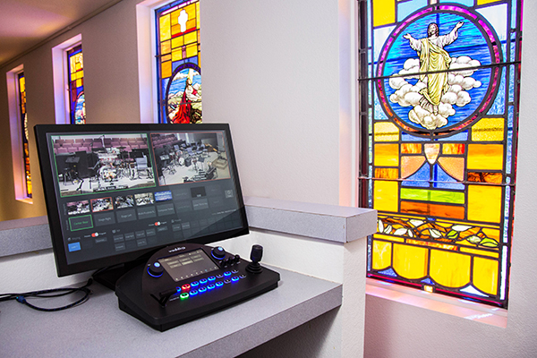 Vaddio equipment near a stained glass window