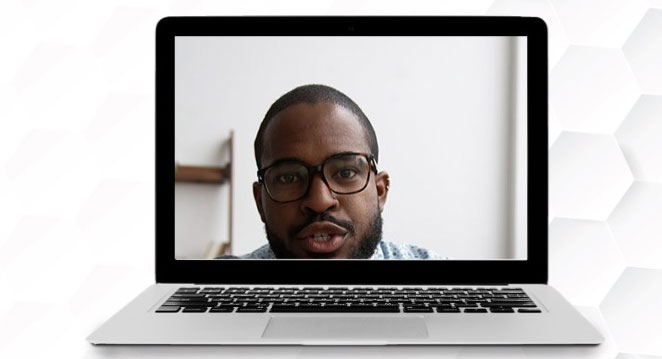 Laptop with a guy not in frame well.