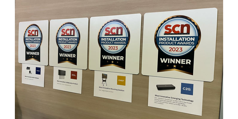 SCN Award notices hanging on a wall at the booth