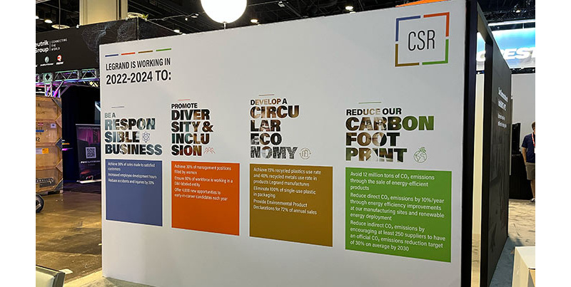 Legrand | AV's CSR initiatives listed out on a wall at the InfoComm booth.