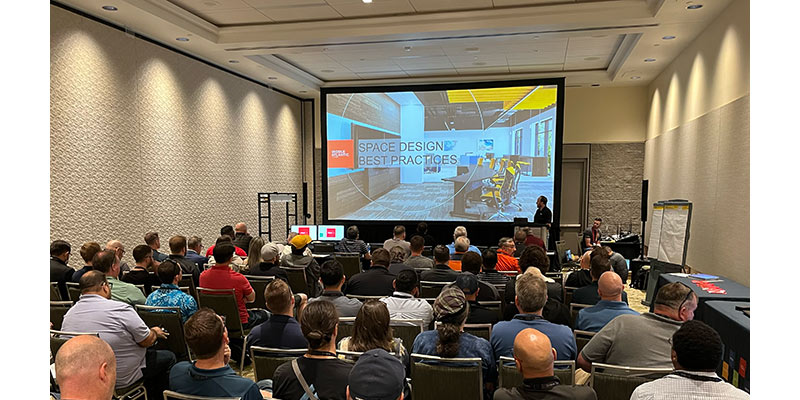 Packed room of people taking a Legrand | AV training course at InfoComm