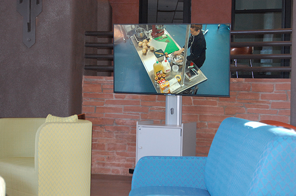 Culinary instructor shown on display in lobby.