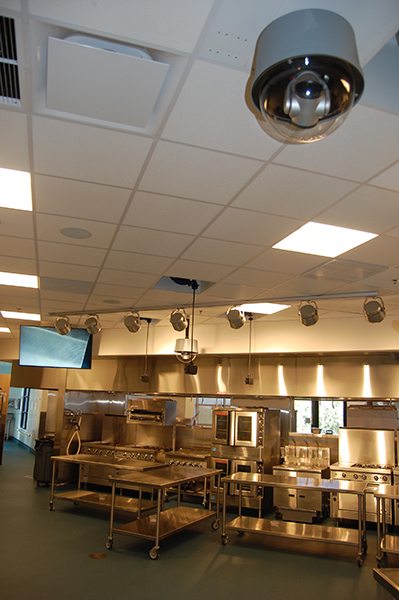 Vaddio camera hanging from ceiling in a culinary classroom.