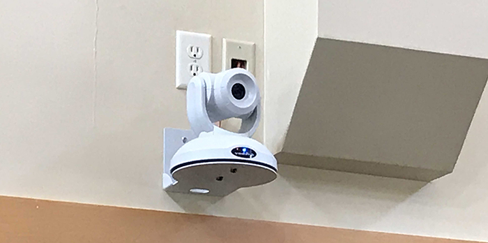 RoboSHOT 40 UHD mounted to wall