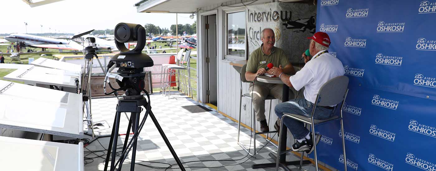 Vaddio camera aimed at two men doing an interview at the airshow