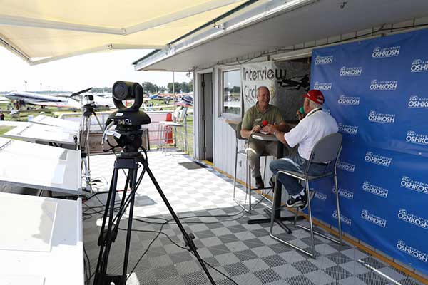 Vaddio camera aimed at two men doing an interview at the airshow