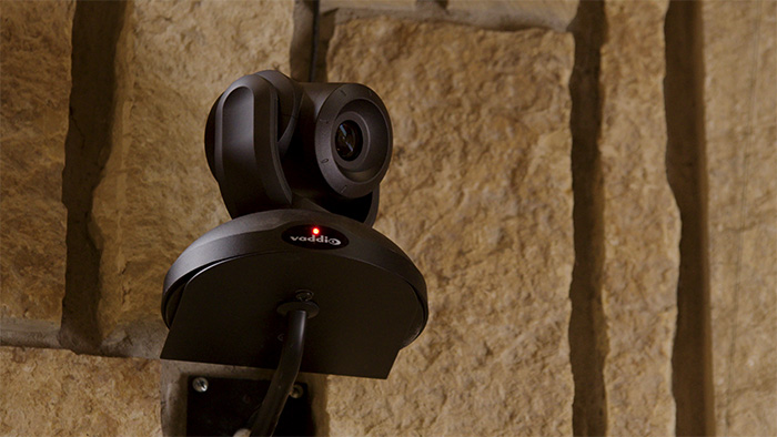 Close up of a Vaddio PTZ camera.