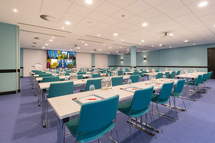 Large conference room with projection screen.