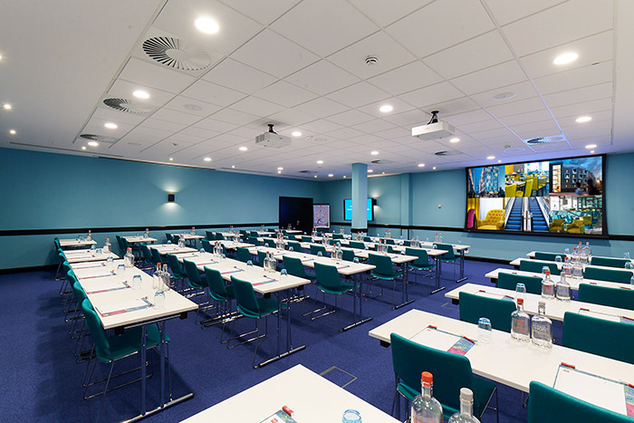 Large conference room with projection screen.