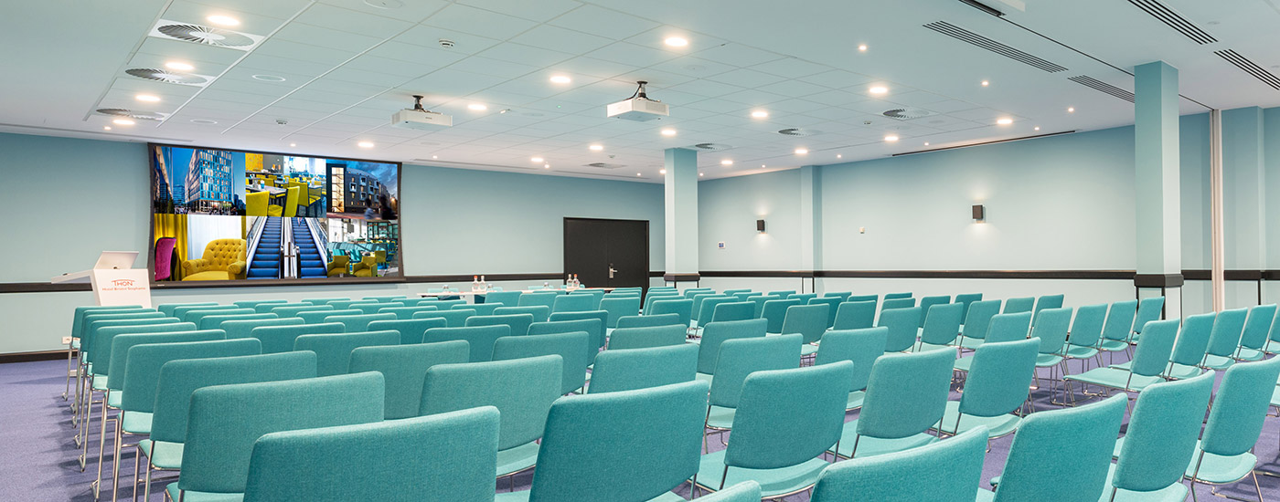 Large conference room with projection screen.