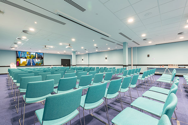 Large conference room with projection screen.