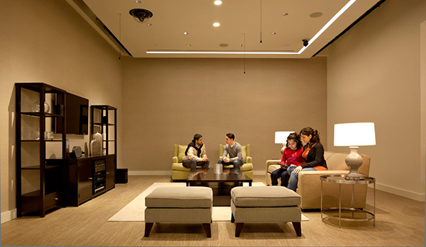 People in a waiting room setting with cameras