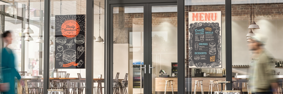 Cable Floor-To-Ceiling Digital Signage solution displayed in restaurant windows