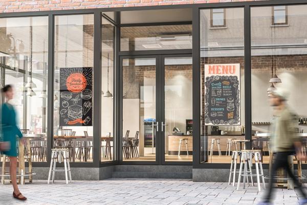 Cable Floor-To-Ceiling Digital Signage solution displayed in restaurant windows