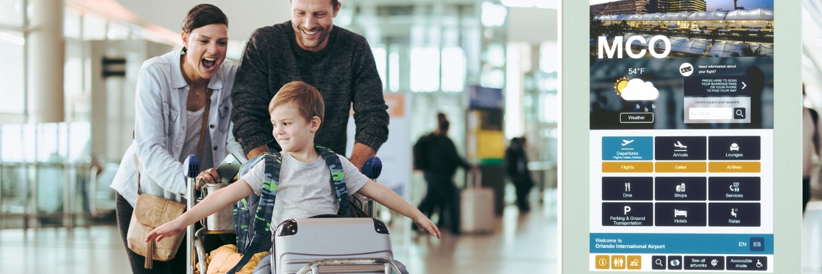 Family walking past Floor Kiosk Back-to-Back digital signage solution at an airport