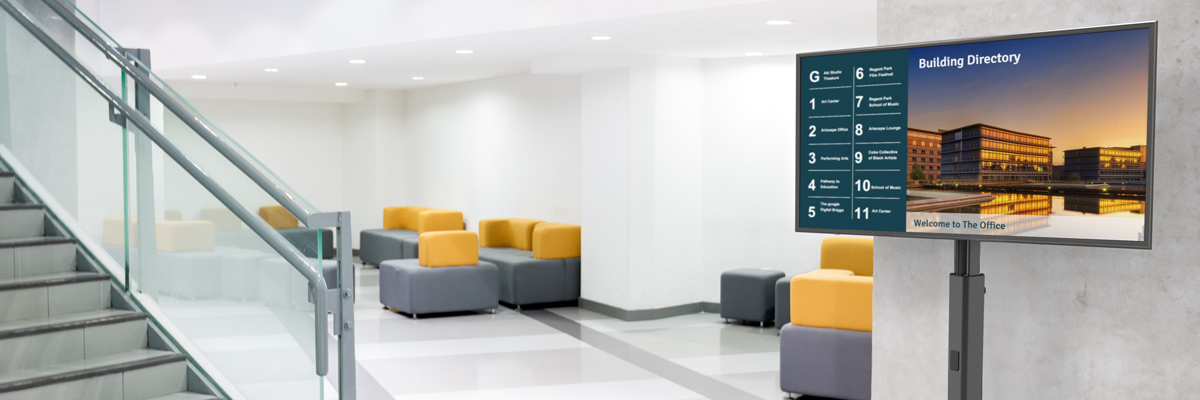 Dual Display Floor Stand for Digital Signage placed in office hallway.