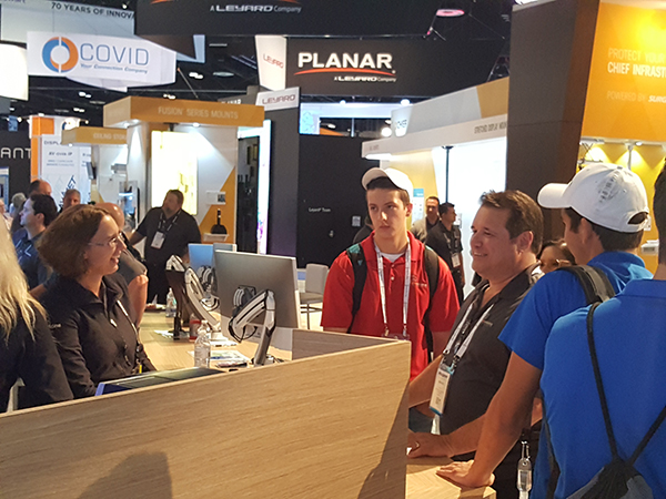 Talking at the coffee counter at InfoComm