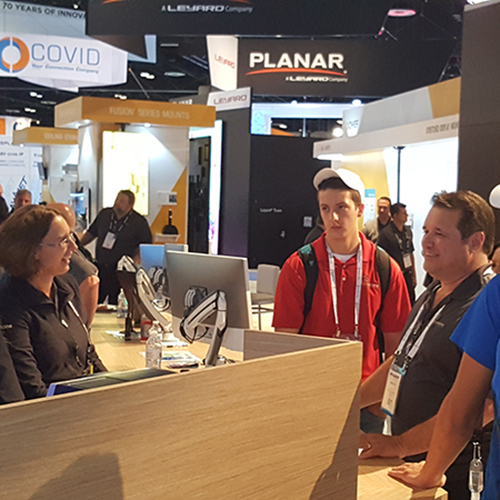 Talking at the counter at InfoComm