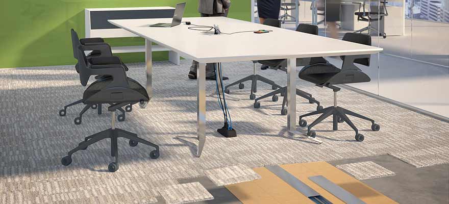 Connectrac products in a conference room with a Green Wall, Table, and Chairs.