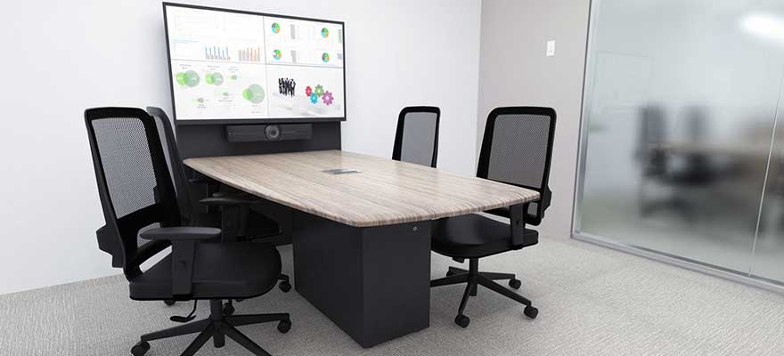 Huddle room with videoconferencing camera and display.