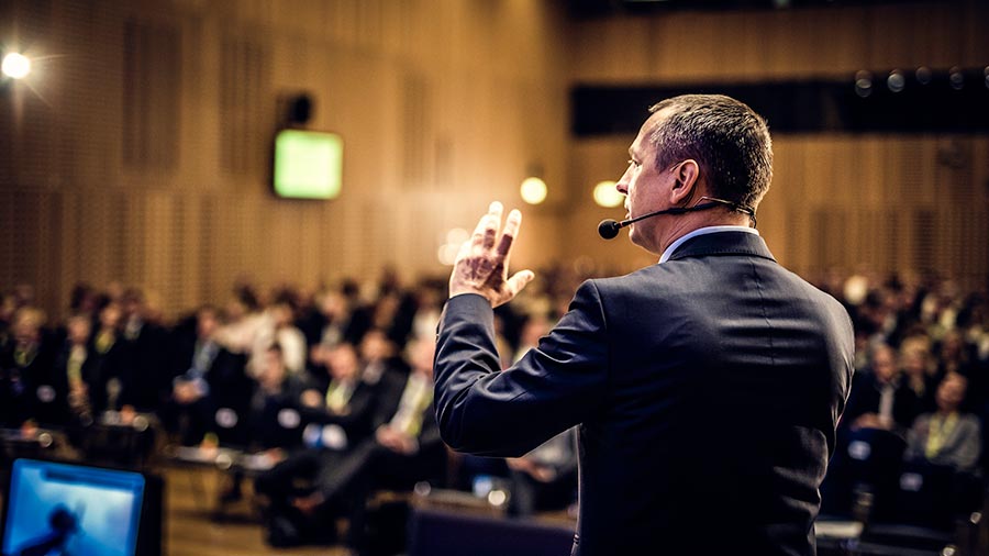 Motivational speaker at corporate event