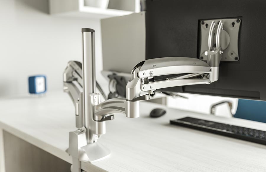 Chief monitor arm on an office desk